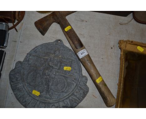 A wooden handle axe and a fire sign