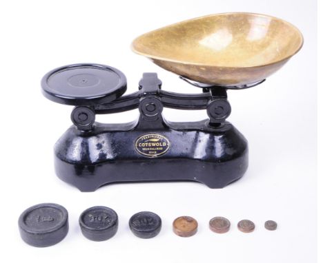Early 20th century Cotswold brass beam balanced weighing scales with weights. Black painted body with metal beam balanced sca