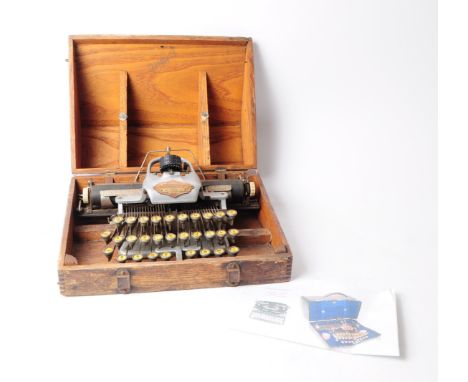 Blickensdefer - A late 19th century Blickensderfer aluminium featherweight typewriter. The typewrighter having aluminium body