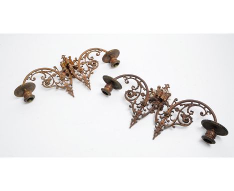 Pair of 19th century brass wall sconces / candle sticks holders. Both feature two adjustable ornate arms each with a candle s