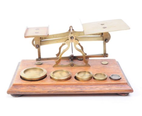 Set of Victorian oak and brass postal scales. Oak base complete with full set of brass weights. Inland postal rates for lette