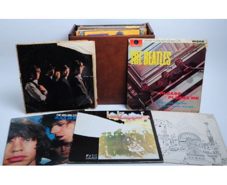 Collection of 20th century rock LP vinyl records housed in a leather record case. Most notable examples being The Rolling Sto