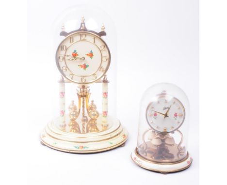 Two vintage 20th century German anniversary mantel clock. Comprised of a Schatz and Sohne glazed domed mantel clock and a lar