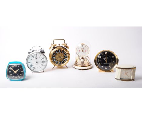 Collection of 20th century mantel clocks, comprised of a Smith Timecal alarm clock, a Westclox blue plastic alarm clock, a We