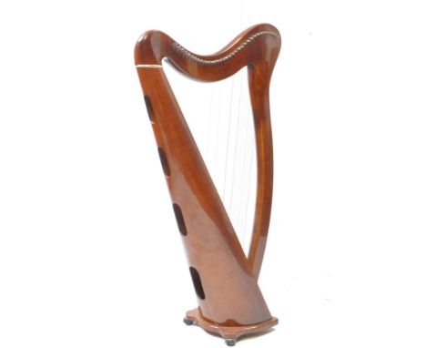 Aoyama - A vintage 20th century Aoyama Japanese walnut cased floor harp. Having a shaped base. Featuring a shaped neck atop.
