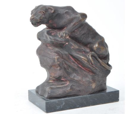 After John Macallan Swan R. A. (1847-1910) A spelter bronze model of a recumbent panther on a naturalistic stone base, inscri