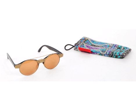 Swatch - A pair of vintage 20th century Swatch sunglasses. The sunglasses having black molded plastic frame, with brushed bra