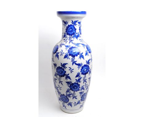 Large late 20th century blue and white floral ceramic vase with a blue decorative border to the flared rim top. Measuring app