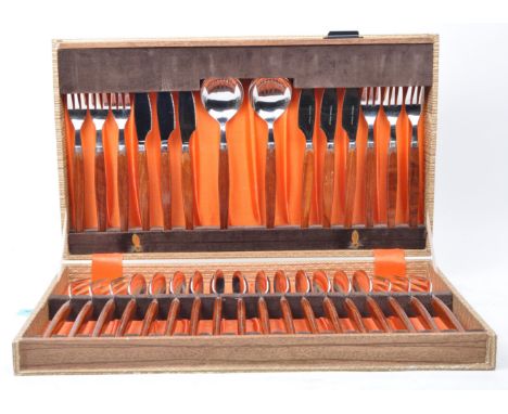 A vintage mid 20th century Dutch Glosswood manner stainless steel cutlery canteen. The canteen containing thirty two pieces. 
