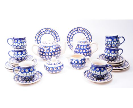20th century Boleslawiec Polish ceramic pottery tea service. Comprised two teapots, six mugs / cups, six saucers, six plates,