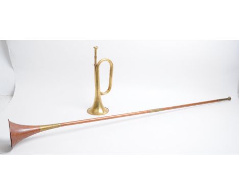 20th century post horn and bugle. Post horn is brass and numbered 819 to the handle. Bugle is copper with brass mounts, able 