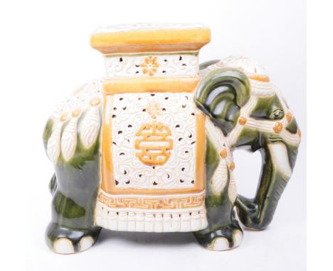 Large vintage 20th century ceramic jardiniere plant stand in the form of an elephant. The jardiniere enamelled in gold and gr