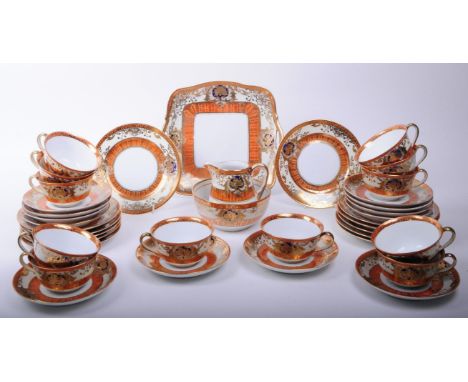 Noritake - Early 20th century Japanese porcelain tea service in orange and gilt detailing. Makers marks stamped to the unders