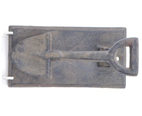 Late 20th century cast iron spade shaped door knocker. Spade attached to a hinged rectangular base with two holes for screws.