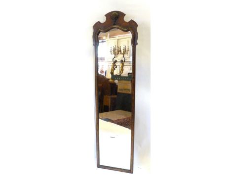 A Walnut Chippendale Style Dressing Mirror, The Shaped Shell Cresting above a rectangular plate, 137cm by 38cm 