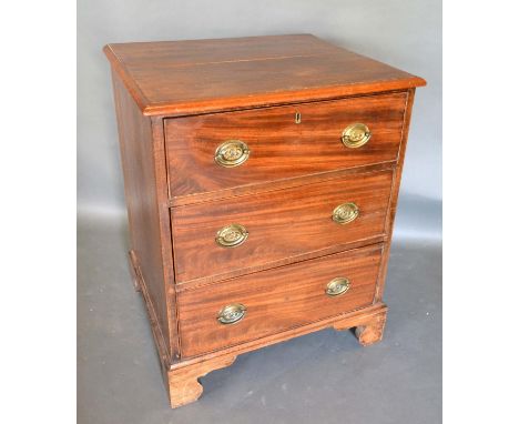 A 19th Century Mahogany Chest, The Moulded Top Above Three Drawers with oval brass handles, raised upon bracket feet, 64cm wi