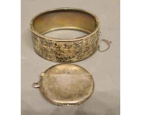 A Birmingham Silver Vesta Case Of Circular Form, together with a Birmingham silver engraved bangle 