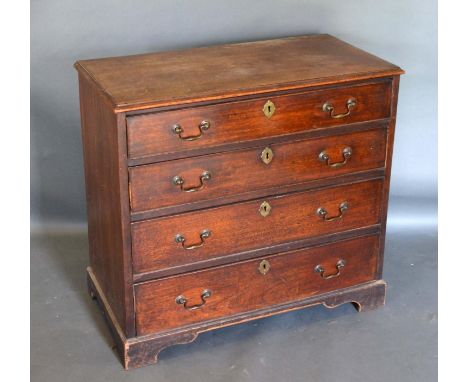 A 19th Century Mahogany Straight Front Chest, The Moulded Top Above Four Long Drawers with brass handles and escutcheons, rai