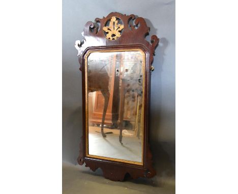 A 19th Century Chippendale Style Mahogany Wall Mirror with gilded foliate cresting, 95cm by 50cm 