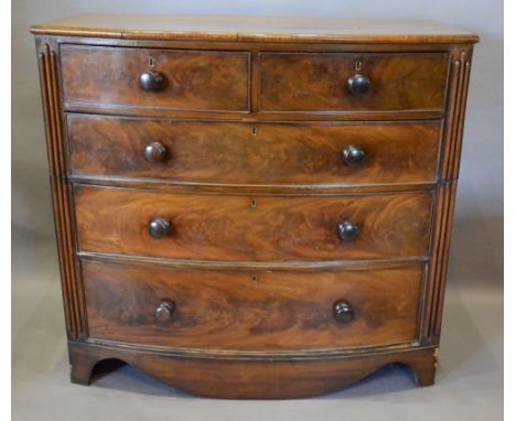 A Victorian Mahogany Bow Fronted Chest Of Two Short and three long drawers with knob handles, raised upon bracket feet, 111cm