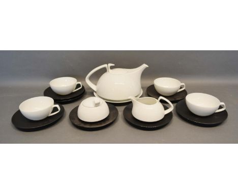 A Rosenthal Breakfast Set Designed By Walter Gropius Of Stylised Form comprising teapot, sugar bowl, cream jug, four cups and