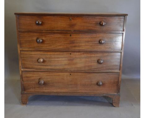 A Victorian Mahogany Straight Front Chest, The Reeded Cross-Banded Top Above Four Long Drawers with knob handles, raised upon