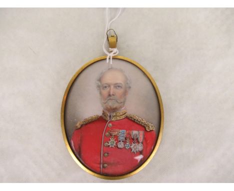 An oval portrait miniature, probably painted on ivory, a gentleman in red military tunic with medals, 8.5cm x 6.5cm, in a gil