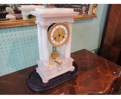 A large alabaster mantle clock, the engine turned gilt dial signed Le Roy du Roi, the eight day bell striking movement number
