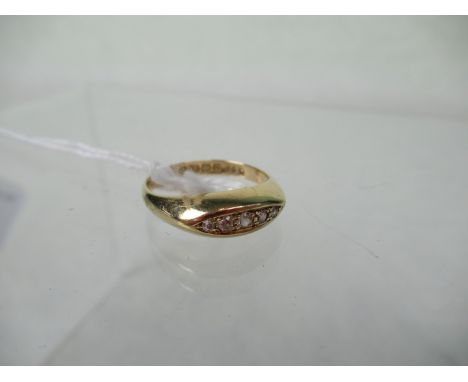 A five stone half-hoop diamond ring, the graduated mixed brilliant cut stones in elliptical setting to plain 18ct gold shank.