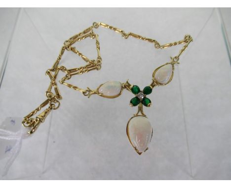 An opal, emerald and diamond necklace, three pearl shaped opals around a central four stone pear shaped emerald and brilliant