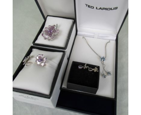 Four items of silver and silver and enamel jewellery.