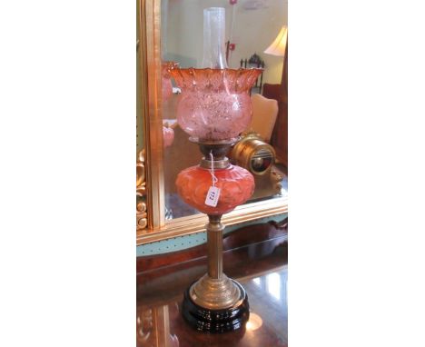 A Victorian oil lamp, having acid etched shade, over opaline glass reservoir on corinthian-style brass column, 69cm.   Condit