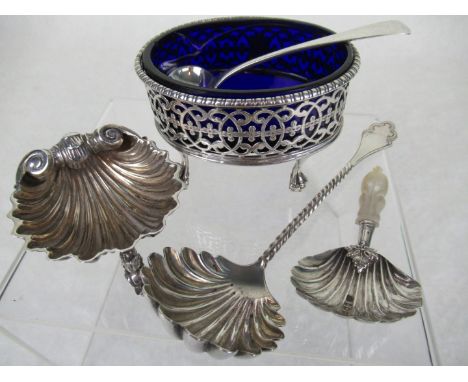 An 18th century oval salt on four ball and claw supports, pierced decoration to the body with blank cartouche, London hallmar