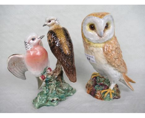 A Beswick ceramic model of an owl no. 1046, 20cm, together with a Beswick pair of doves, no. 1022.