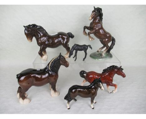 A collection of six ceramic horses, to include examples by Beswick and Royal Doulton.