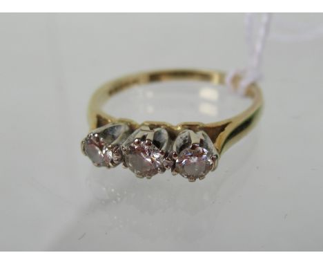 An 18ct gold three stone diamond ring.