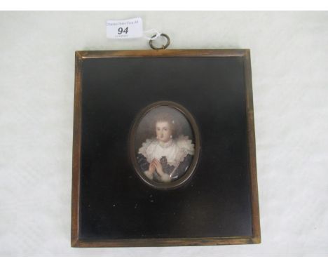 A brass and ebonised framed oval portrait miniature, of a smartly dressed lady in 17th century dress, the interior backing ca