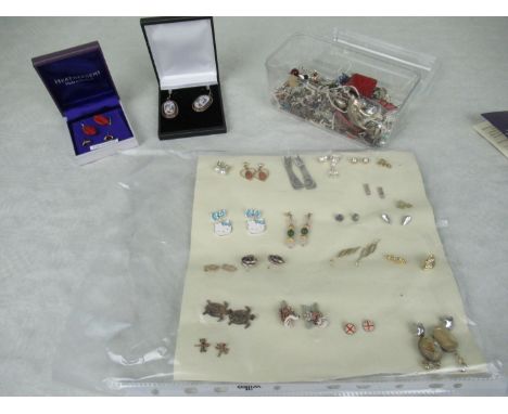 A large quantity of costume earrings, to include enamel and stone set examples.