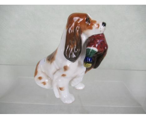 A Royal Doulton ceramic figurine of a Gun Dog with Pheasant (HN1028), 13.5cm tall.