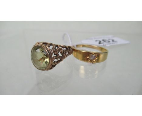 An 18 carat gold stone set ring, together with a 9ct gold citrine ring, the oval stone to pierced shank.