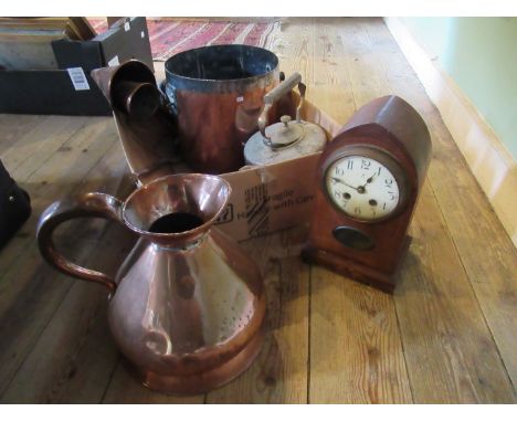 A mixed lot of copper ware, to include: teapot, a jug and others, together with a wooden cased mantle clock.