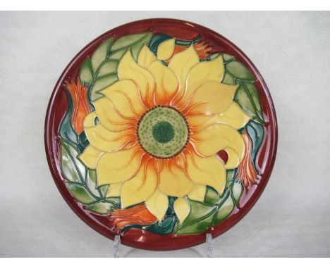 A contemporary Moorcroft plate, designed by Rachel Bishop, in the Inca Sunflower pattern, painted and impressed marks to base