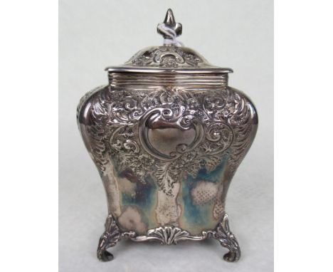 A late Victorian silver tea caddy, having hinged lid, repoussé scroll decoration with blank cartouche to each side, Sheffield