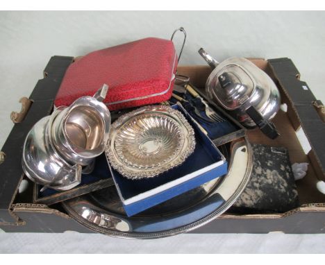 A three piece silver plated tea set, comprising: teapot, twin handled sugar bowl and milk jug, together with a quantity of si