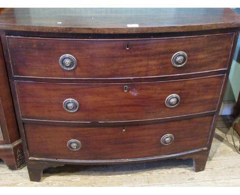 A Victorian mahogany bow front three drawer chest on bracket feet, 91cm wide.