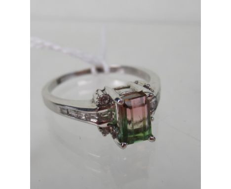 A bi-coloured watermelon tourmaline ring, rectangular cut cornered with brilliant cut diamond detail to corners and graduated