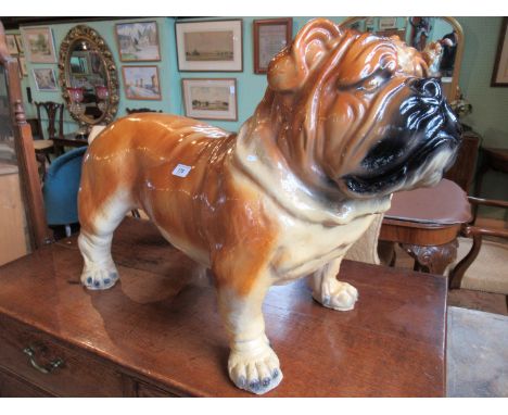 A large 1950's ceramic shop advertising mascot, for Friskies Dog Food, modelled as a bulldog, 49 x 68 x 36cm.   Condition Rep