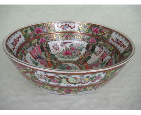 A large Chinese Famille Rose open bowl, having profuse decoration, depicting figures in interior scenes with bird and foliate