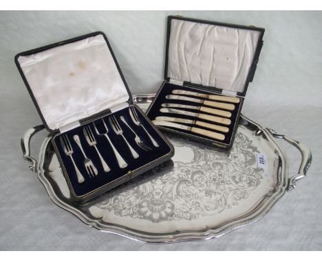 A silver plated twin handled tray, together with two sets of silver plated flatware.