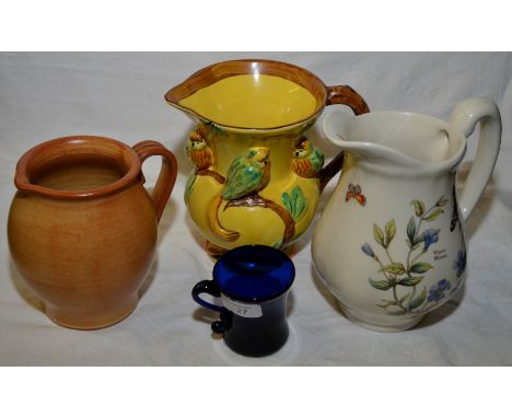 Wade Heath parrot jug, Florabunda jug, Stoneware jug and small blue glass beaker with curled handle